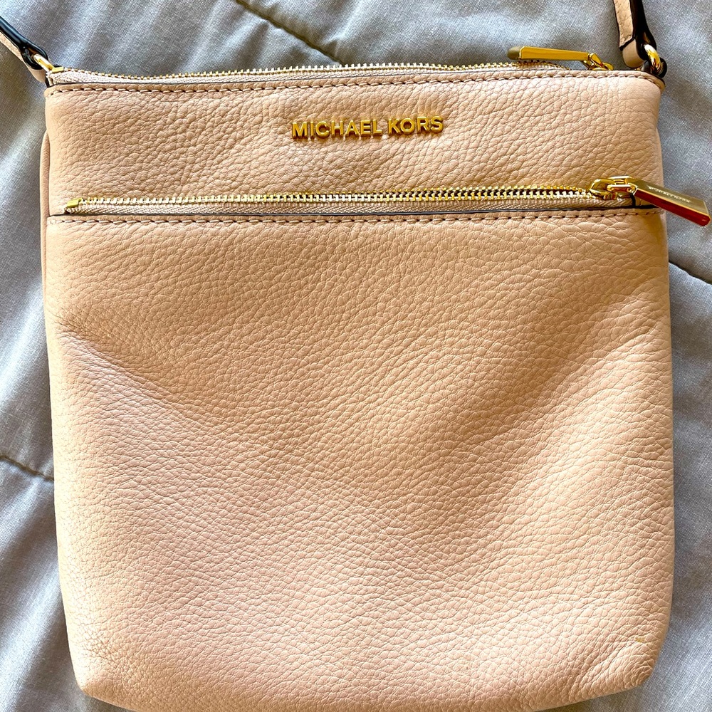 Pink Michael Kors crossbody bag.